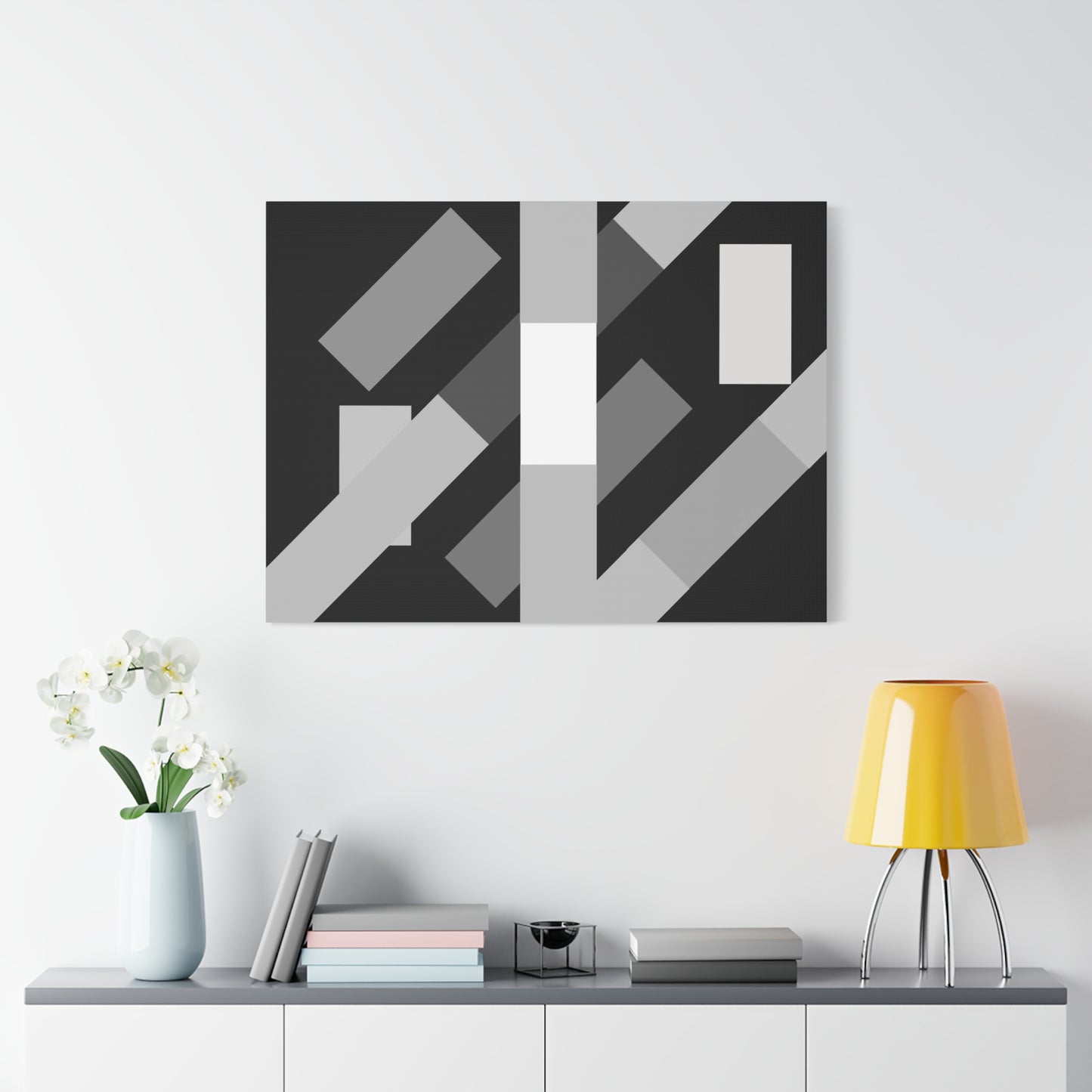 abstract geometric flyover canvas artwork above a shelf with lampstand