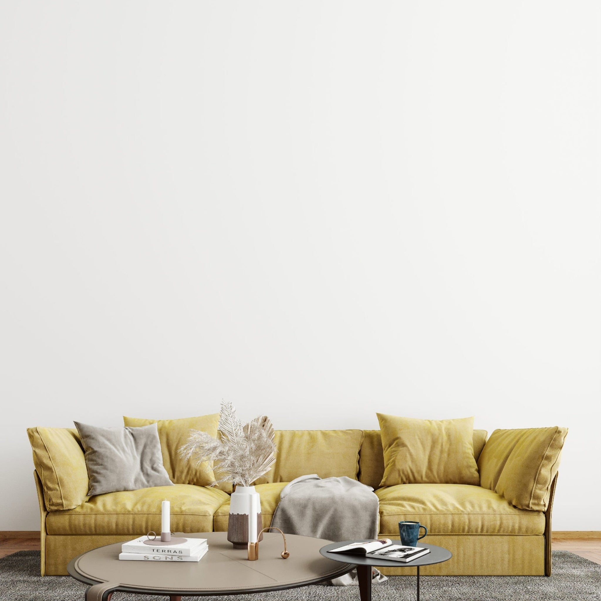 Yellow sofa in a minimalistic living room with a white wall.