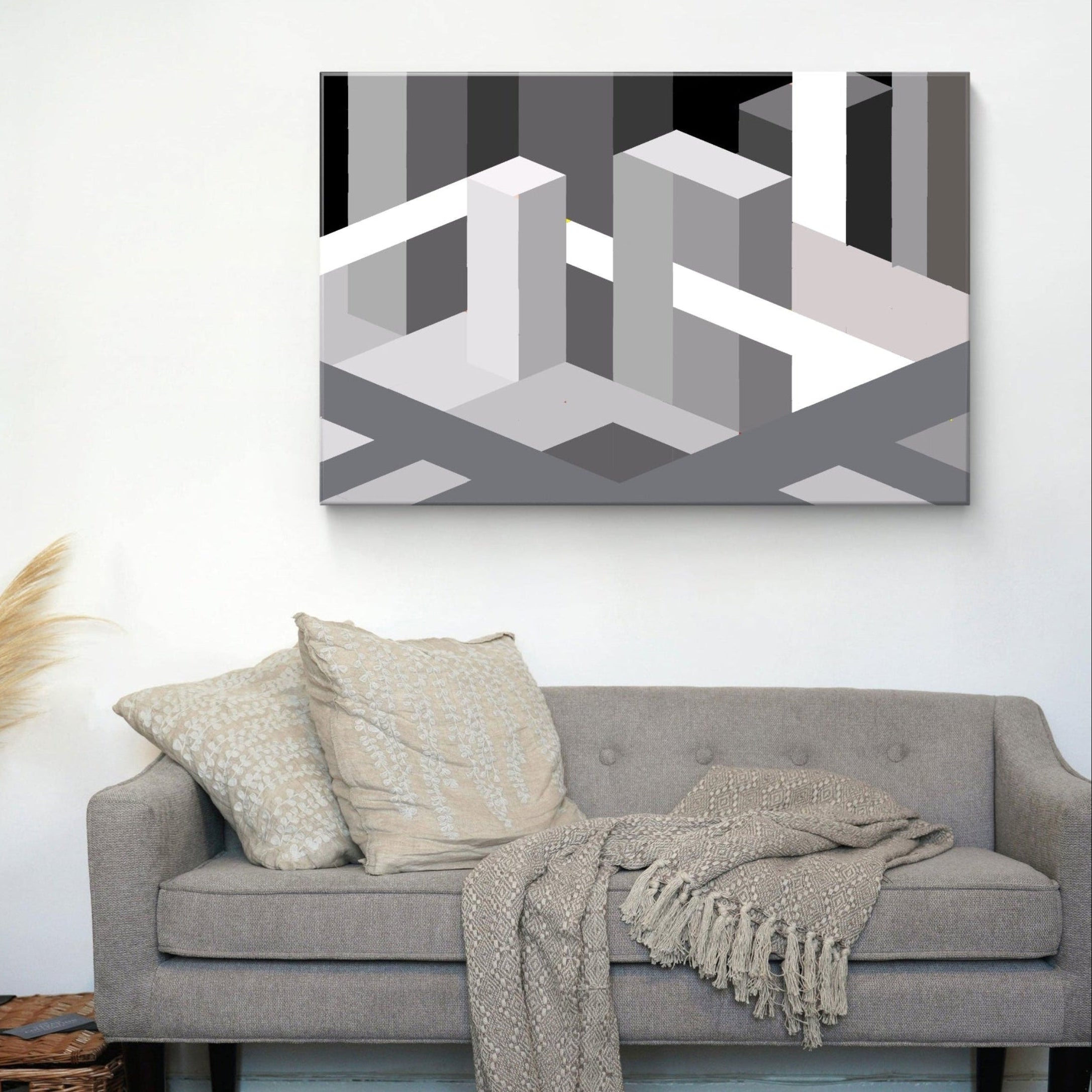 Large monotone abstract architectural canvas art above a Gray sofa with decorative pillows 